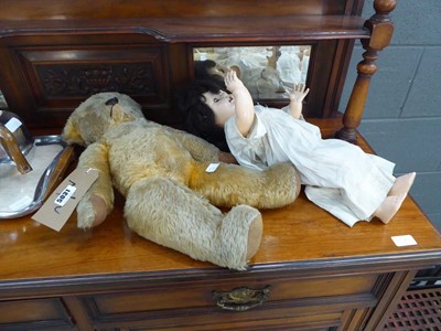 Lot 5031 - Distressed teddy bear plus a moulded plastic doll