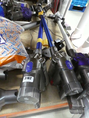 Lot 3162 - 2 handheld Dyson vacuums with pole, head and...