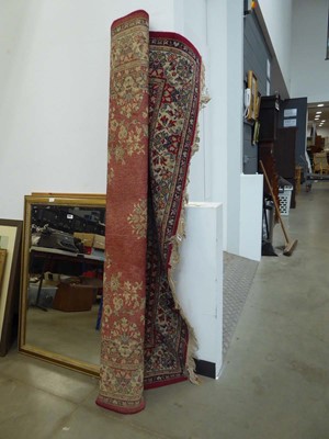 Lot 5340 - Large floral carpet with red background