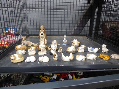 Lot 5530 - Cage containing miniature cat dog figures
