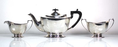 Lot 201 - An early 20th century silver three piece tea...