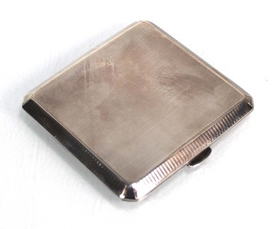 Lot 203 - A silver engine turned cigarette case of...