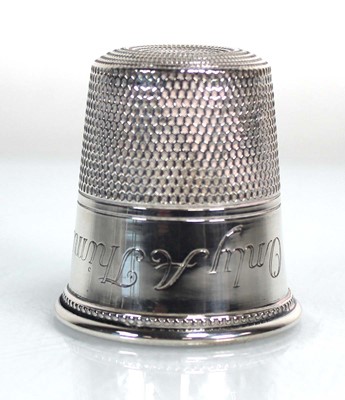 Lot 205 - A metalware thimble of oversized proportions,...