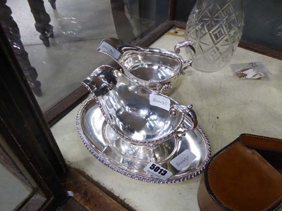 Lot 5013 - Two silver plated gravy/sauce boats and a stand