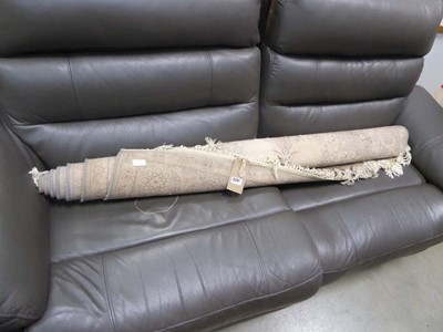 Lot 5291 - Beige and pink floral carpet