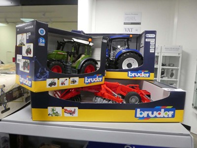Lot 2197 - 2 Bruder tractors boxed along with a seed...