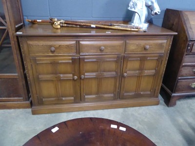 Lot 5316 - Ercol sideboard three drawers over three doors