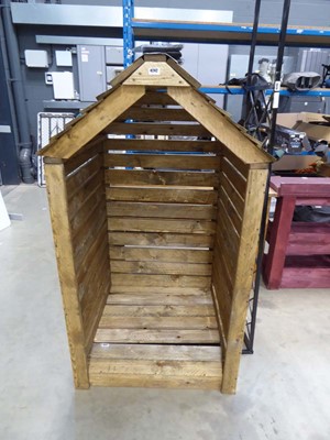 Lot 4242 - Timber log store. Dimensions: 1.6m height,...