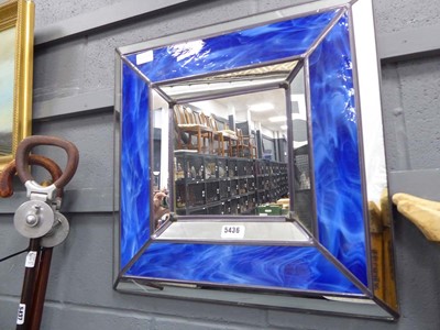 Lot 5436 - Square mirror with blue glass frame