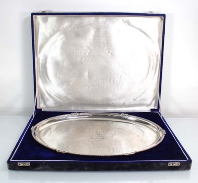 Lot 240 - A metalware tray of oval form with gadrooned...