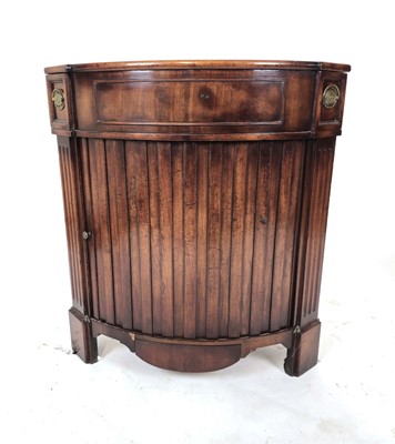 Lot 7 - An Empire-style mahogany corner cabinet, the...