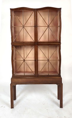 Lot 9 - A 20th century walnut display cabinet by The...