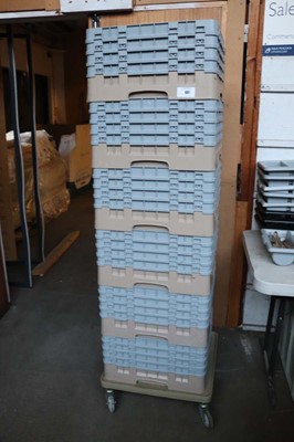 Lot 601 - Small 4 wheel plastic trolley with a stack of...