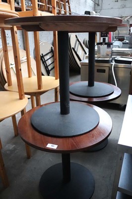 Lot 637 - 4 dark oak effect 75cm diameter black pedestal...