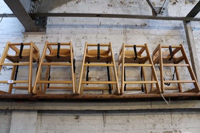 Lot 773 - Five wooden stackable child's highchairs