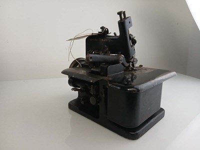 Lot 2099 - A vintage Singer USA small manual overlocker...