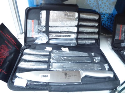 Lot 3184 - Canvas cased nine piece Japan triple hardened...