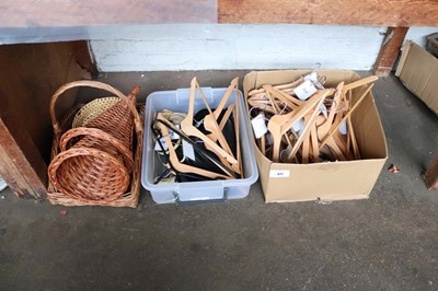 Lot 927 - 2 boxes of coat hangers plus some wicker displays