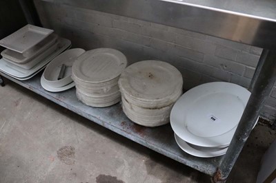 Lot 836 - Shelf of various large chargers and serving...