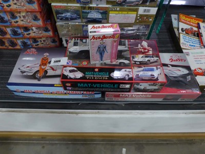 Lot 2066 - Three boxed Japanese car model kits depicting...