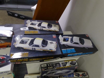 Lot 2068 - Three boxed Japanese car model kits depicting...