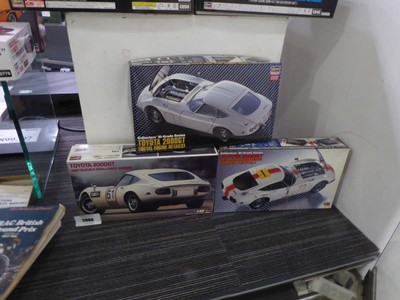 Lot 2069 - Three boxed Japanese car model kits depicting...