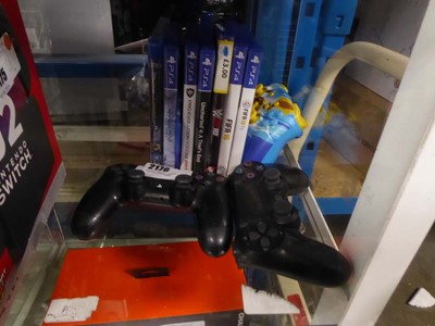 Lot 2176 - 3 PlayStation controllers along with a...