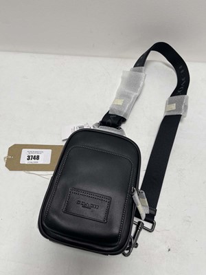 Lot 3748 - Coach New York race sling bag in black