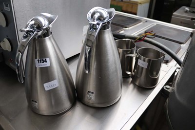 Lot 1154 - Two Elia stainless water jugs plus two creamers