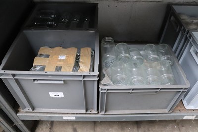 Lot 1354 - Three plastic stacking crates containing glass...