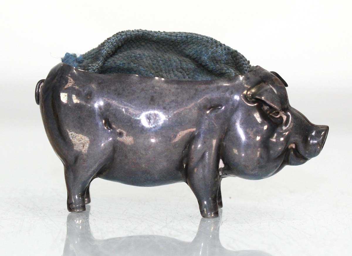 Lot 296 - An Edwardian silver pin cushion modelled as a...