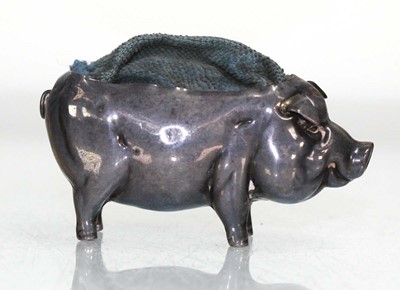 Lot 296 - An Edwardian silver pin cushion modelled as a...