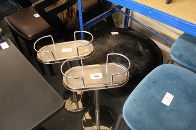 Lot 1403 - Two stainless steel wine bottle stands plus a...