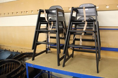 Lot 1404 - Four black stacking children's high chairs