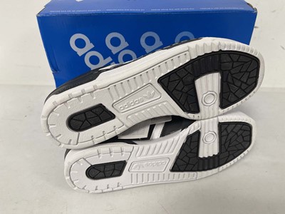 Lot 3857 - Adidas rivalry low trainers in black size...