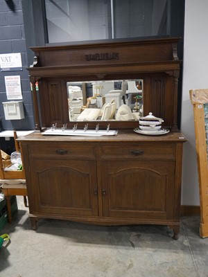 Lot 1056 - Dark oak sideboard with large beveled mirror...