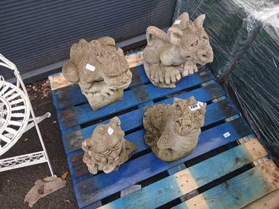 Lot 4163 - Four garden statues comprising three dragons...