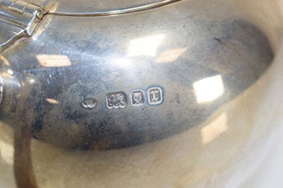 Lot 334 - A silver teapot of spherical form, makers mark...