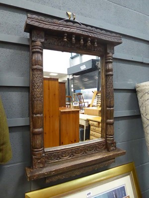 Lot 5231 - Rectangular mirror in heavily carved wooden frame