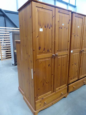 Lot 5250 - Modern pine double wardrobe with drawer under