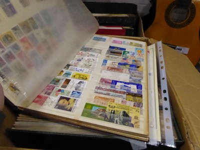 Lot 2438 - 2 boxes containing various stamps in albums
