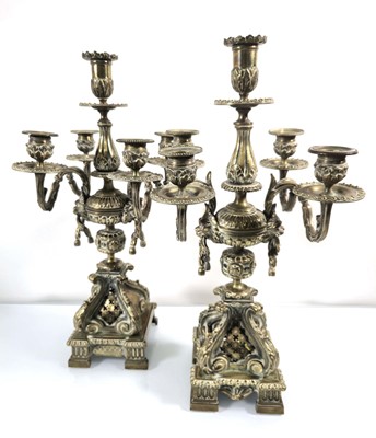 Lot 115 - A pair of gilt metal five-branch candelabrum...