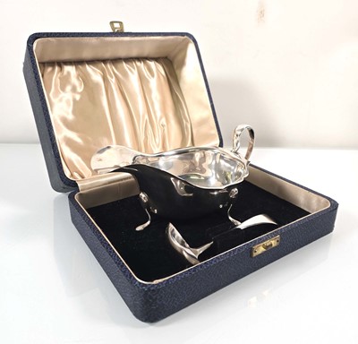 Lot 200 - An Edward VIII silver sauce boat and ladle,...