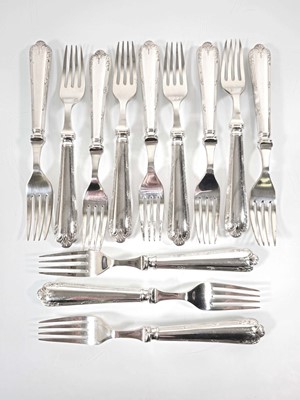 Lot 203 - A set of twelve silver forks with filled...