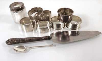 Lot 222 - A group of silver including seven napkin rings,...