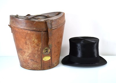 Lot 128 - A Victorian leather hat box containing a silk...