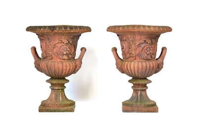 Lot 26 - A pair of terracotta planters of classical urn...