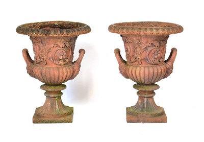 Lot 26 - A pair of terracotta planters of classical urn...