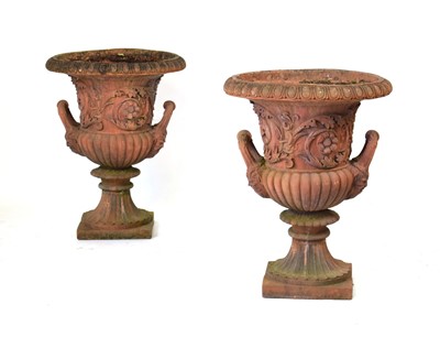 Lot 26 - A pair of terracotta planters of classical urn...