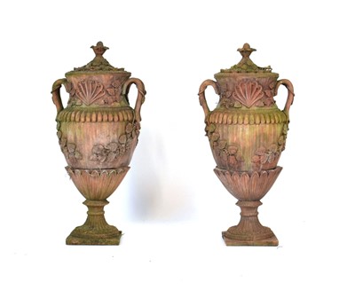 Lot 27 - A pair of terracotta covered planters on...